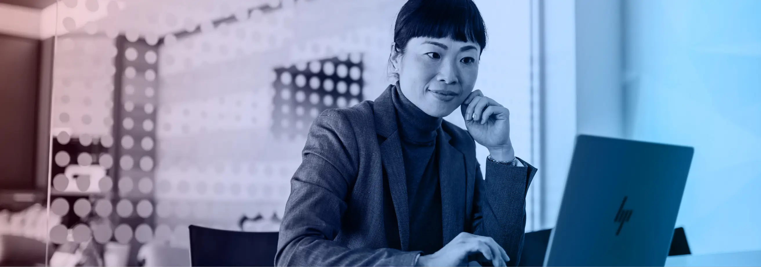A woman in an office working on the HP ZBook Ultra G1a