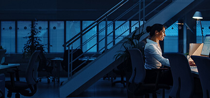 Woman working at a computer.