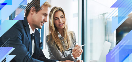 Two people looking at a computer 
