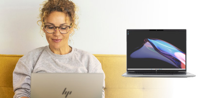A person sitting on a couch using a HP laptop