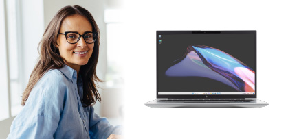 A person smiling next to a computer