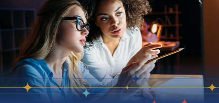 Two women looking at a screen