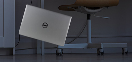 A Dell laptop falling to the floor
