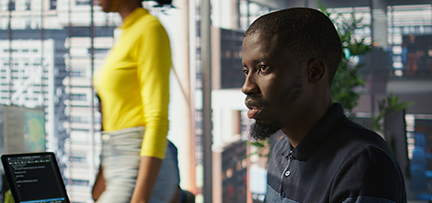 A person working at a computer in a modern office 
