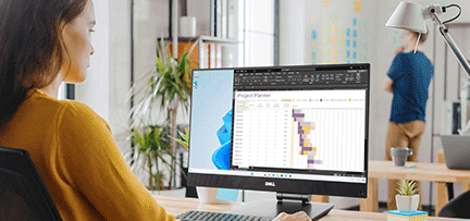 Woman working at a Dell PC.