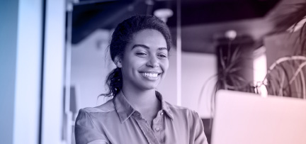 A worker at a computer in a modern office 