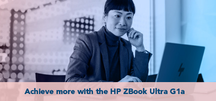 A person in an office working at a laptop  